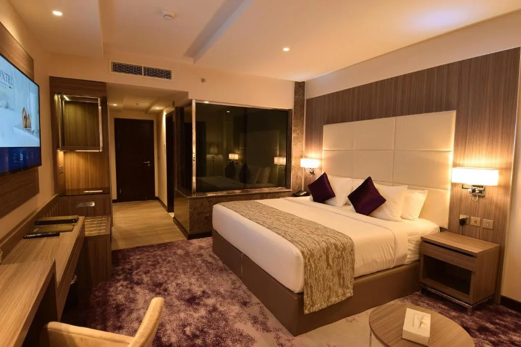 Walnut tones and cream details in a Frontel Hotel Jeddah interior